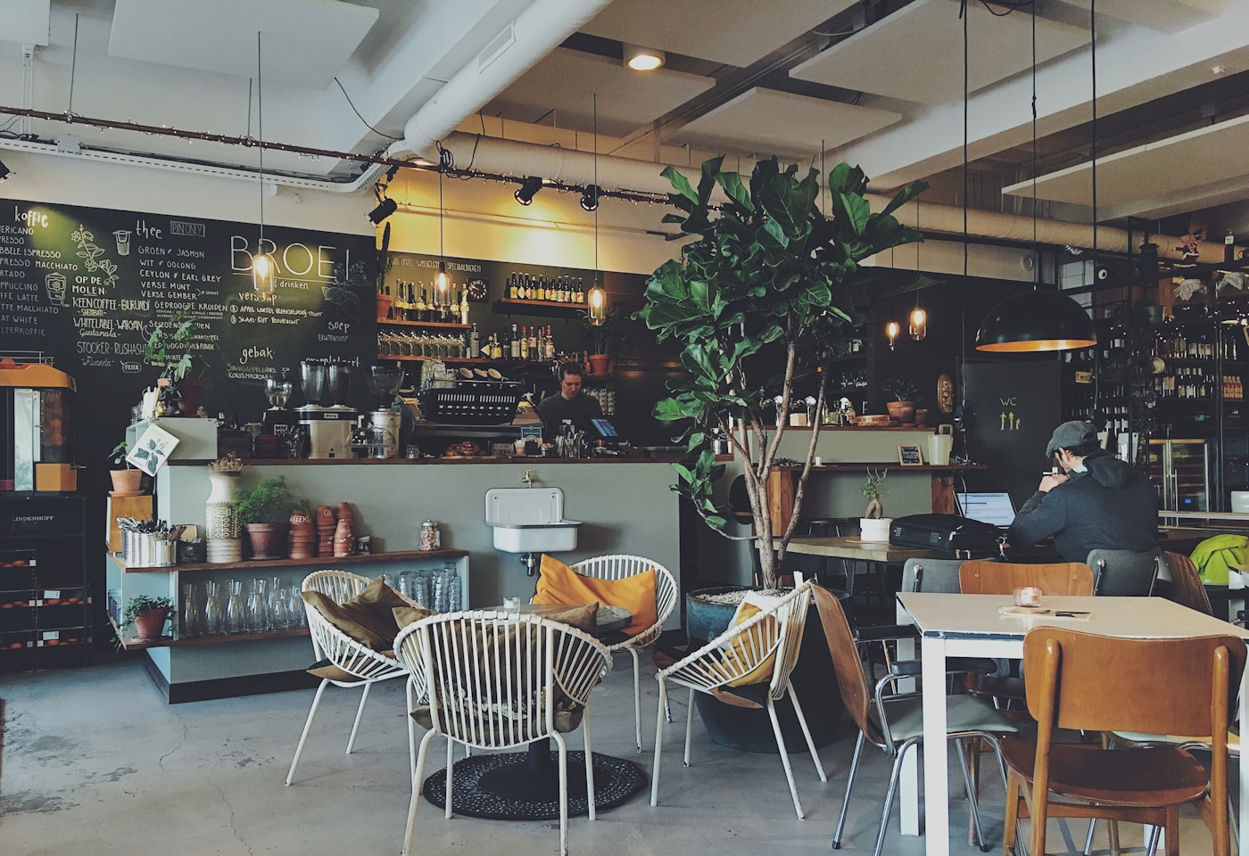 Guests enjoying coffee at a café with loyalty and CRM touchpoints